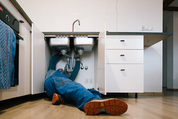 Professional Emergency Plumber technician working in Brownsville, IN